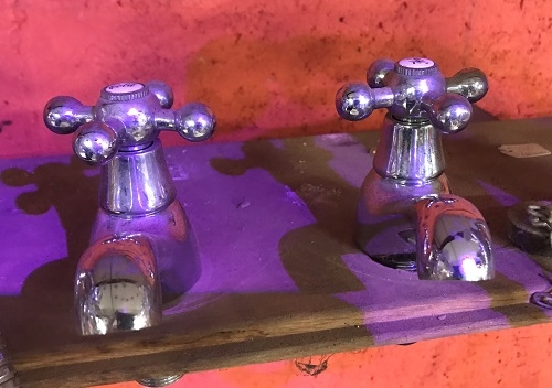 A reclaimed pair of chrome taps