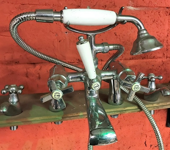 A reclaimed set of chrome telephone taps