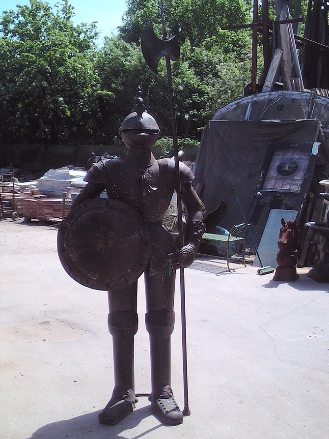 Old style knight statue with candle holder inside